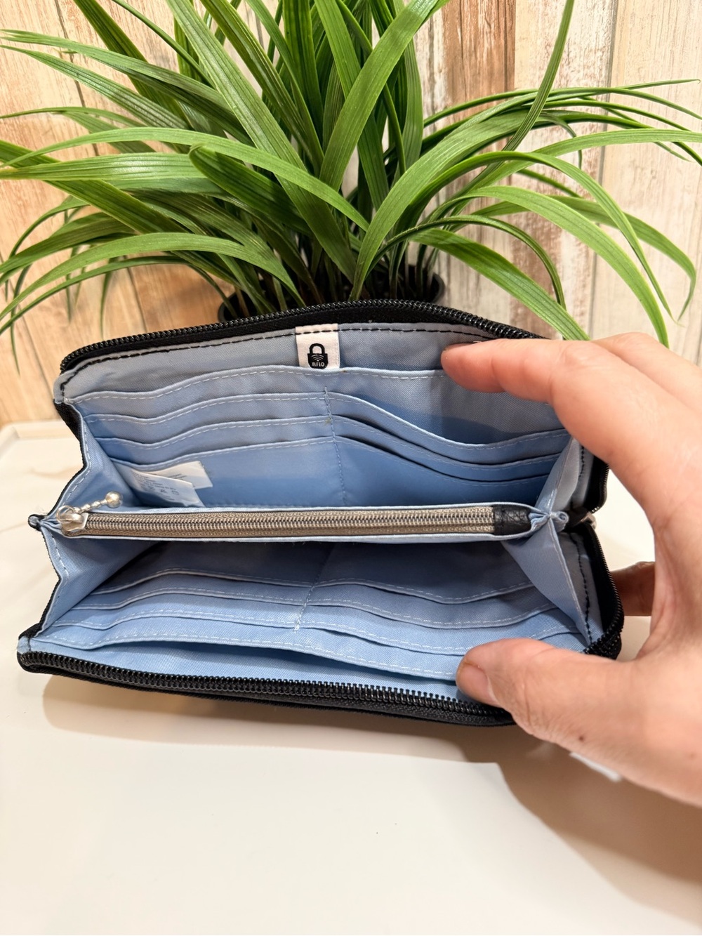 Baggallini Zip Around Wallet featuring a wrist strap and RFID protection, Black - Picture 3 of 8